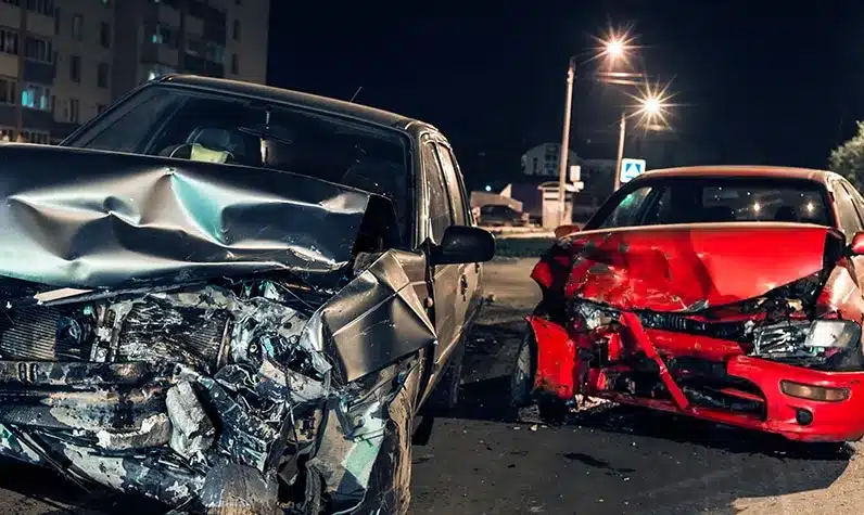 two wrecked cars next to each other