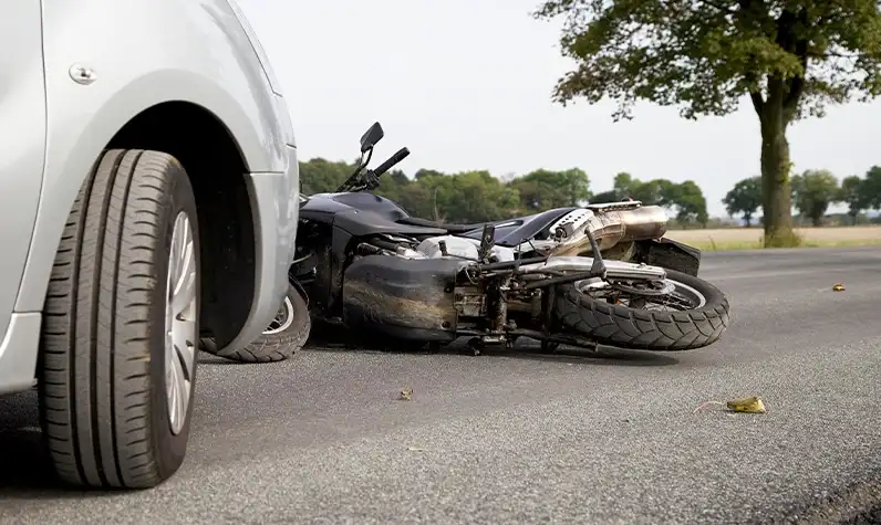 a crashed motorcycle lying on the road