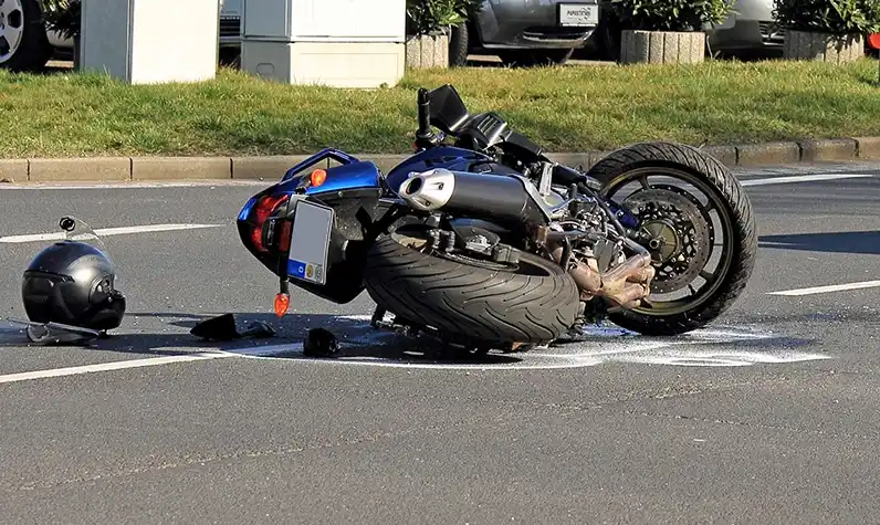 a motorcycle lying on the road