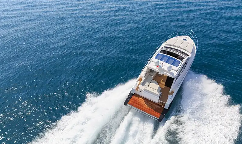 a cruiser boat sailing across a waterbody