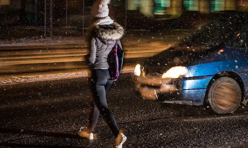 a pedestrian crossing a road